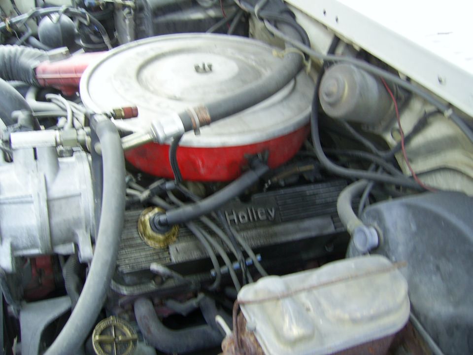 Engine bay with Holley valve covers and round air cleaner