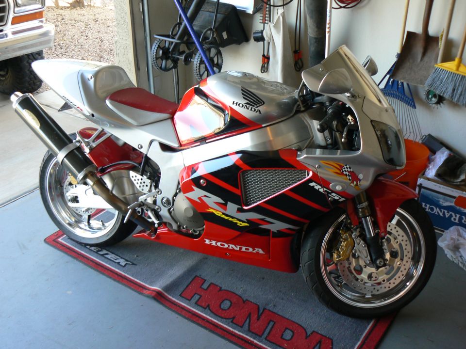 Red and silver Honda RC51 motorcycle with racing decals