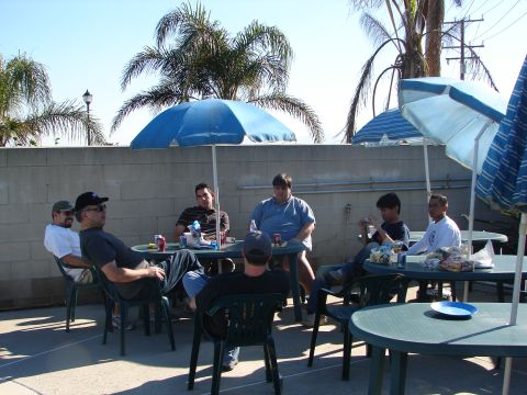 1992 Ford Taurus - People gathered at tables outside on a sunny day.