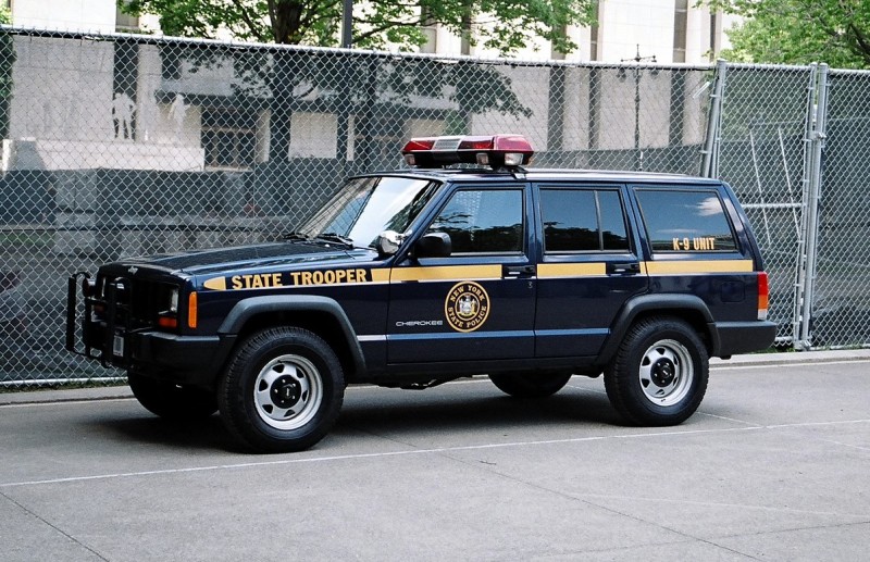 Navy New York State Police K-9 Jeep Cherokee patrol vehicle, driver-side view