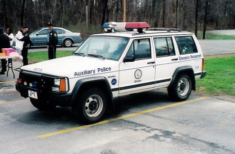 1991 Ford Crown Victoria - This white Jeep Cherokee is marked as Auxiliary Police and Emergency Management.