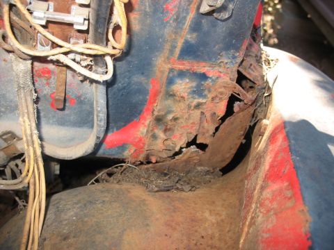 1949 Chevrolet C/K Pickup - Detail of heavily rusted metal and electrical wiring, likely from an older vehicle.
