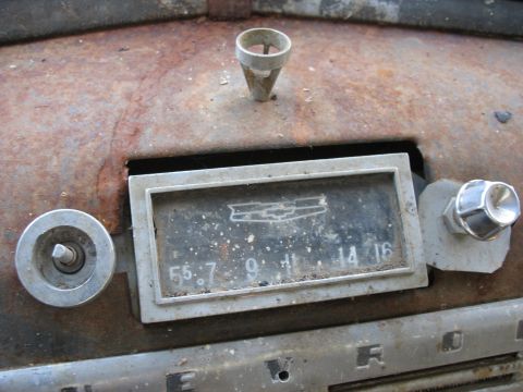 1949 Chevrolet C/K Pickup - Vintage Chevrolet radio and dashboard details, showing signs of rust and age.