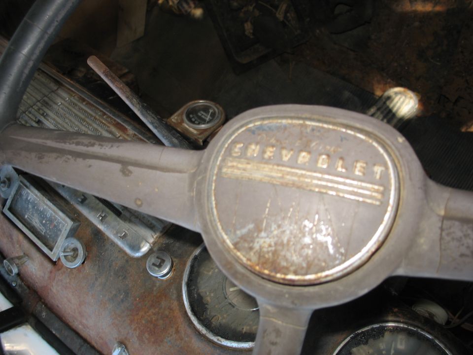 1949 Chevrolet steering wheel with dashboard gauges and radio