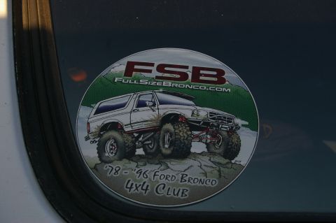1986 Ford Bronco - A sticker depicting a lifted Ford Bronco is affixed to a vehicle's window.