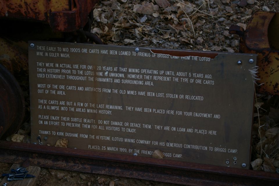 Sign about early to mid 1900s ore carts loaned to Friends of Briggs Camp from the Lotus Mine