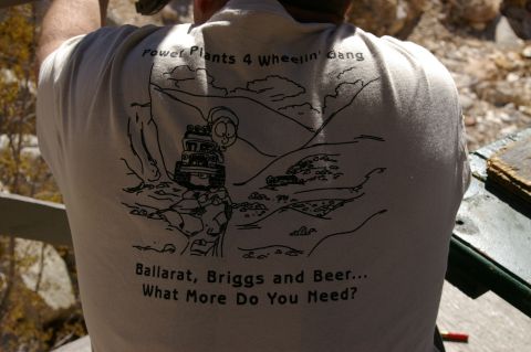 1986 Ford Bronco - A t-shirt displays a humorous cartoon of an off-road vehicle adventure, complete with text about locations and necessities.