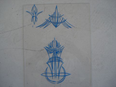 1979 Chevrolet C/K Pickup - Sheet of clear plastic displays blue pinstripe art with various designs, including a flame and a face motif.