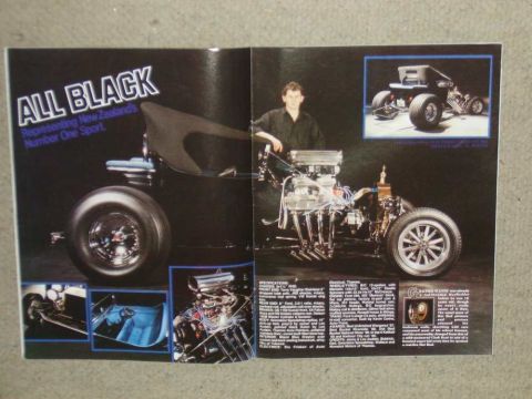 1969 Lincoln Continental - A custom hot rod, featured in a magazine spread, showcases its powerful V8 engine and black body.