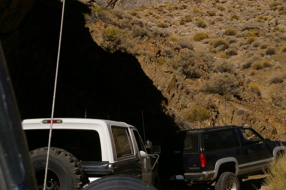 1986 Ford Bronco rear view, white top, spare tire, off-road