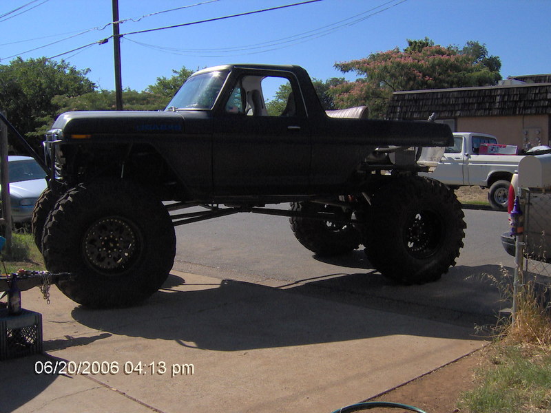 Black lifted 1978 Ford Bronco side view with large tires