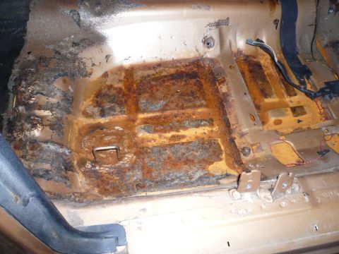 1975 Ford Ranchero - The floor pan of this vehicle shows extensive rust damage and deterioration.