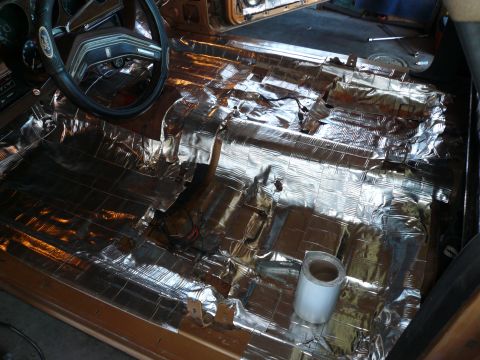 1975 Ford Ranchero - Sound deadening material covers the floor of a 1975 Ford Ranchero interior.