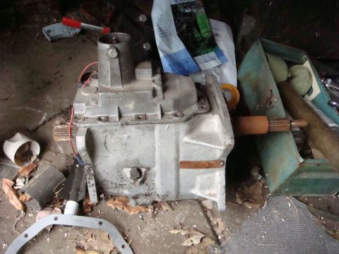 1980 Jeep CJ5 - Jeep T-18 transmission, likely from an older CJ model, stored with other parts.