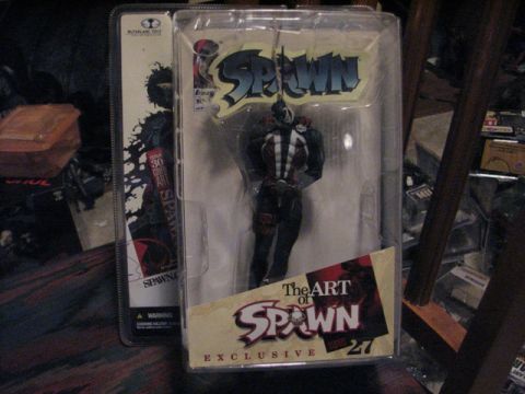 1991 Ford Bronco - Action figure packaging for 'The Art of Spawn' is displayed, with a figure inside.