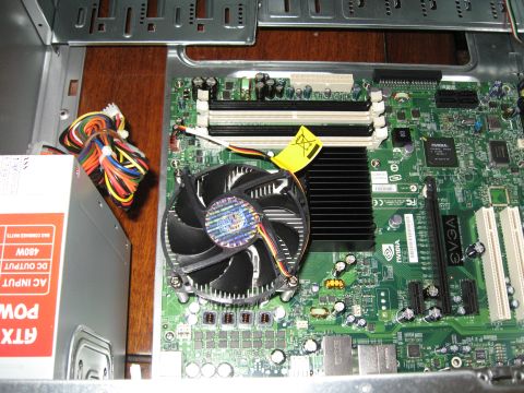 1988 Ford Bronco - Internal view of a computer build, showing the motherboard, cooling fan, and power supply unit.