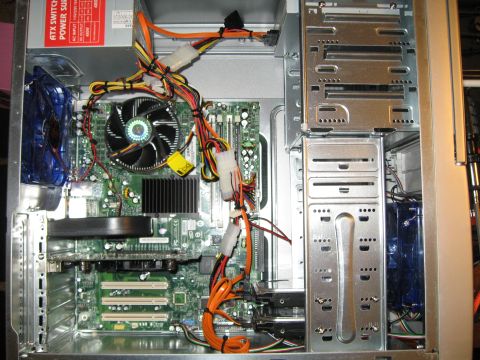 1988 Ford Bronco - Computer internals showing motherboard, power supply, fan, and wiring.