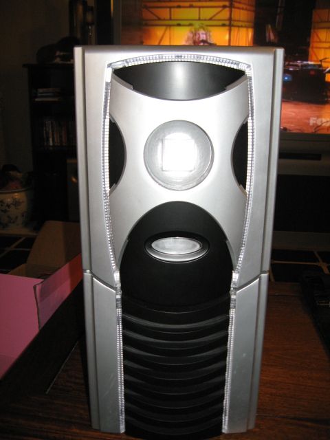 1988 Ford Bronco - A computer tower is shown in front of a television screen displaying a scene.