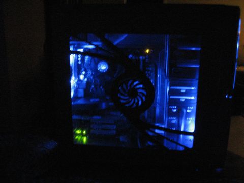 1988 Ford Bronco - A computer tower with blue LED lighting and a prominent fan is visible in the dark.
