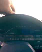 1991 Mazda MX-6 - A hand is shown adjusting a dashboard gauge cluster with a prominent "SUPERMOTORS" watermark.