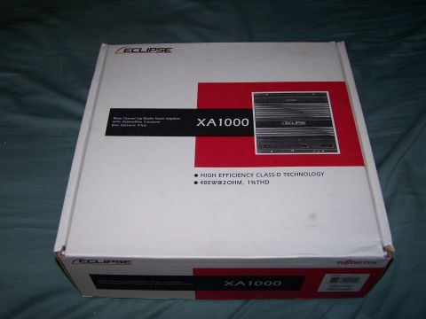 1995 Ford Probe - The box for an Eclipse XA1000 amplifier is shown, detailing its power and technology specifications.