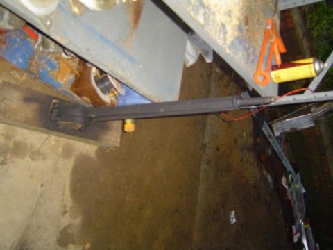 1979 Ford Bronco - A close-up view shows a section of a vehicle's frame with exposed red wiring, suggesting a repair or modification.