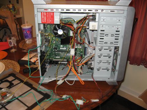 1988 Ford Bronco - Internal components of a computer case are visible, including the motherboard, CPU fan, power supply, and numerous wires.