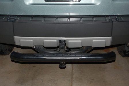 2006 Ford Escape - Rear view of a 2006 Ford Escape showing its bumper, tow hitch, and step.