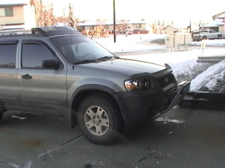 2006 Ford Escape - 2006 Ford Escape parked outside with snow on the ground and a custom grille guard installed.