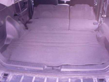 2006 Ford Escape - The stock floor was a plastic deck with cheesy carpet that always bunched up when loading things. The jack was relocated behind the stock d…