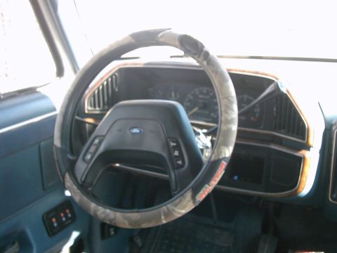 1987 Ford Bronco - Interior view of a 1987 Ford Bronco, the steering wheel and dashboard.