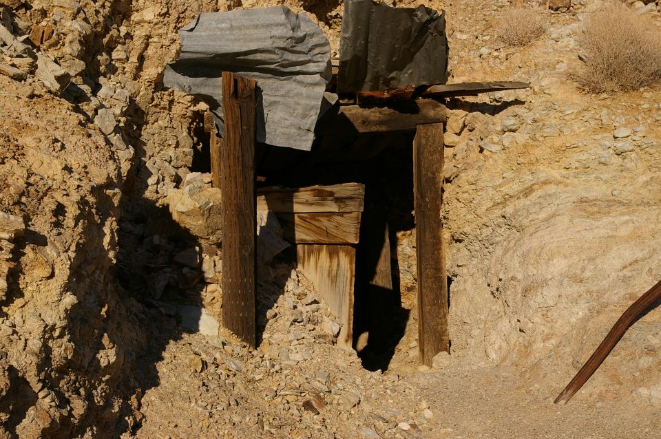 Wooden mine entrance in rocky terrain