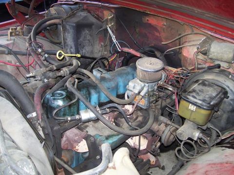 2004 Jeep TJ - Close-up view of the engine compartment, showing various mechanical components and wiring.