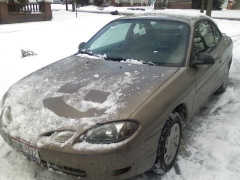 2004 Yamaha FZR600 - Car parked outside in the snow with a smiley face drawn on the hood.