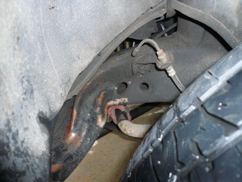 1975 Ford Ranchero - Detail shot of vehicle suspension and tire, with Supermotors.net watermark visible.