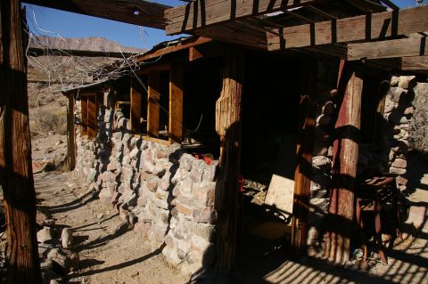 1986 Ford Bronco - An old stone structure stands in a dry, arid environment under a clear blue sky.