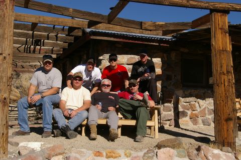 1986 Ford Bronco - A group of friends gathered outdoors, enjoying a sunny day in a rustic setting.