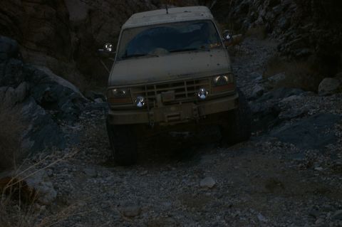 1986 Ford Bronco - This Ford Bronco navigates a challenging, rocky path in a narrow canyon.