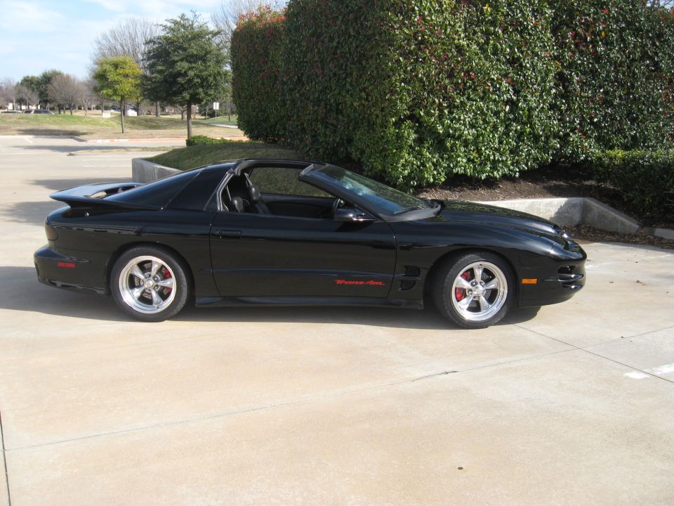 Black 2002 Pontiac Trans Am, side view, lowered suspension