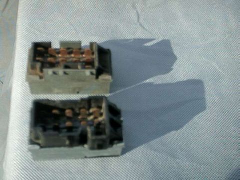 1976 Ford Ranchero - Two electrical connectors with visible copper terminals are shown on a textured surface.