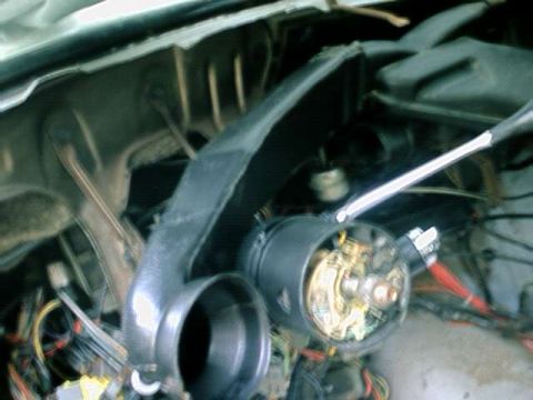 1976 Ford Ranchero - The image shows a close-up view of a vehicle's steering column and associated wiring, with a prominent black plastic shroud.