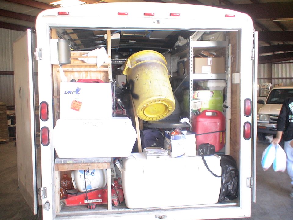 Interior of a white cargo trailer filled with items
