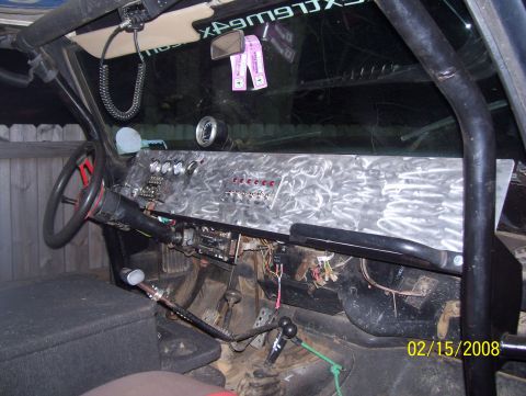 1978 Ford Bronco - Interior view of a vehicle's custom dashboard numerous switches and gauges.