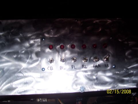 1978 Ford Bronco - A close-up of a custom-made dashboard panel multiple toggle switches and indicator lights.