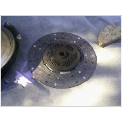 1972 Ford Ranchero - A clutch disc and pressure plate are shown, likely for a vehicle transmission rebuild.