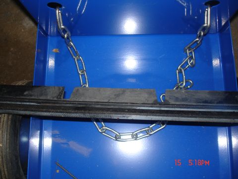 1979 Ford Bronco - Close-up of chains and rubber bumpers on a blue surface, with Supermotors.net watermark.
