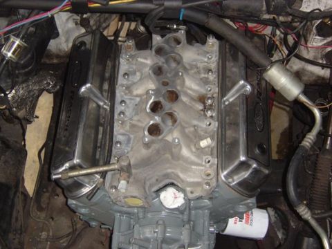1989 Ford Bronco - Close-up view of an engine assembly, showing the intake manifold and valve covers.