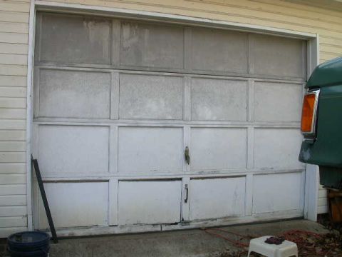1990 Ford Bronco - Old, crappy, wood & MDF, rotten along the bottom garage door.