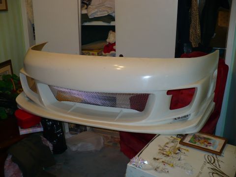 1993 Ford Probe - Aftermarket front bumper with mesh grille, likely for a sports car.