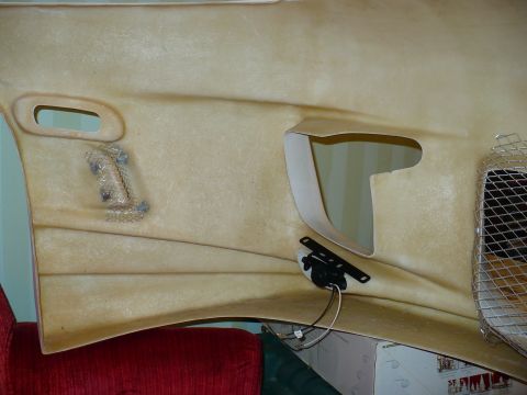 1993 Ford Probe - A tan fiberglass car interior panel is shown, likely a custom modification, with a speaker mount and wiring visible.